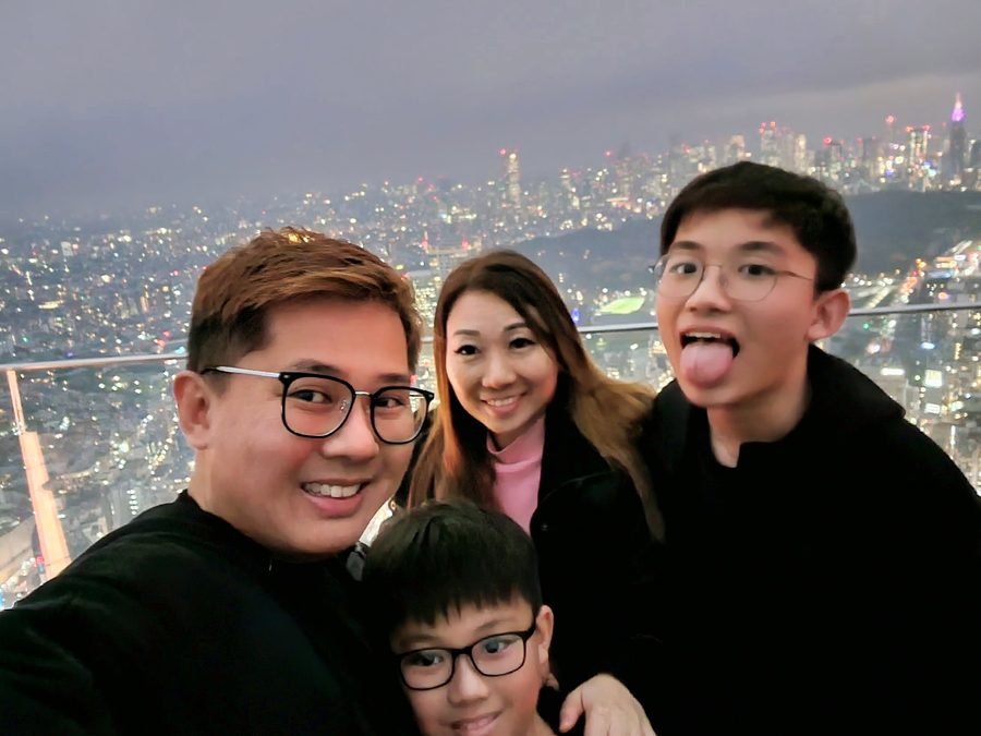 Family above the Tokyo skyline at night